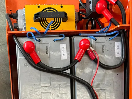 Battery and charger are organized in the same compartment